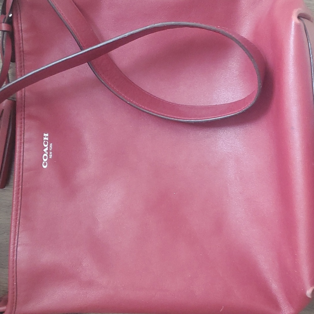 coach burgundy leather duffle purse, there is wear and tear, see pictures